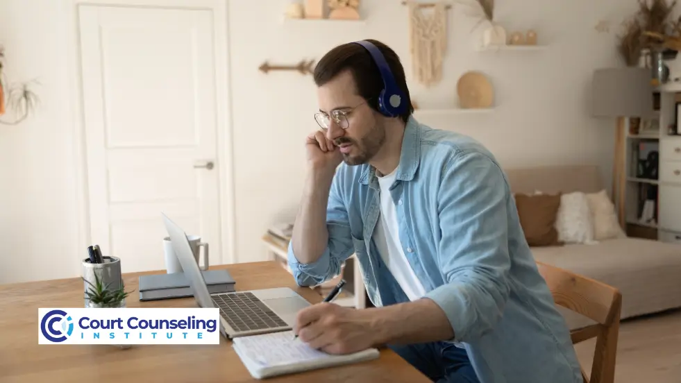 Man viewing anger management course videos